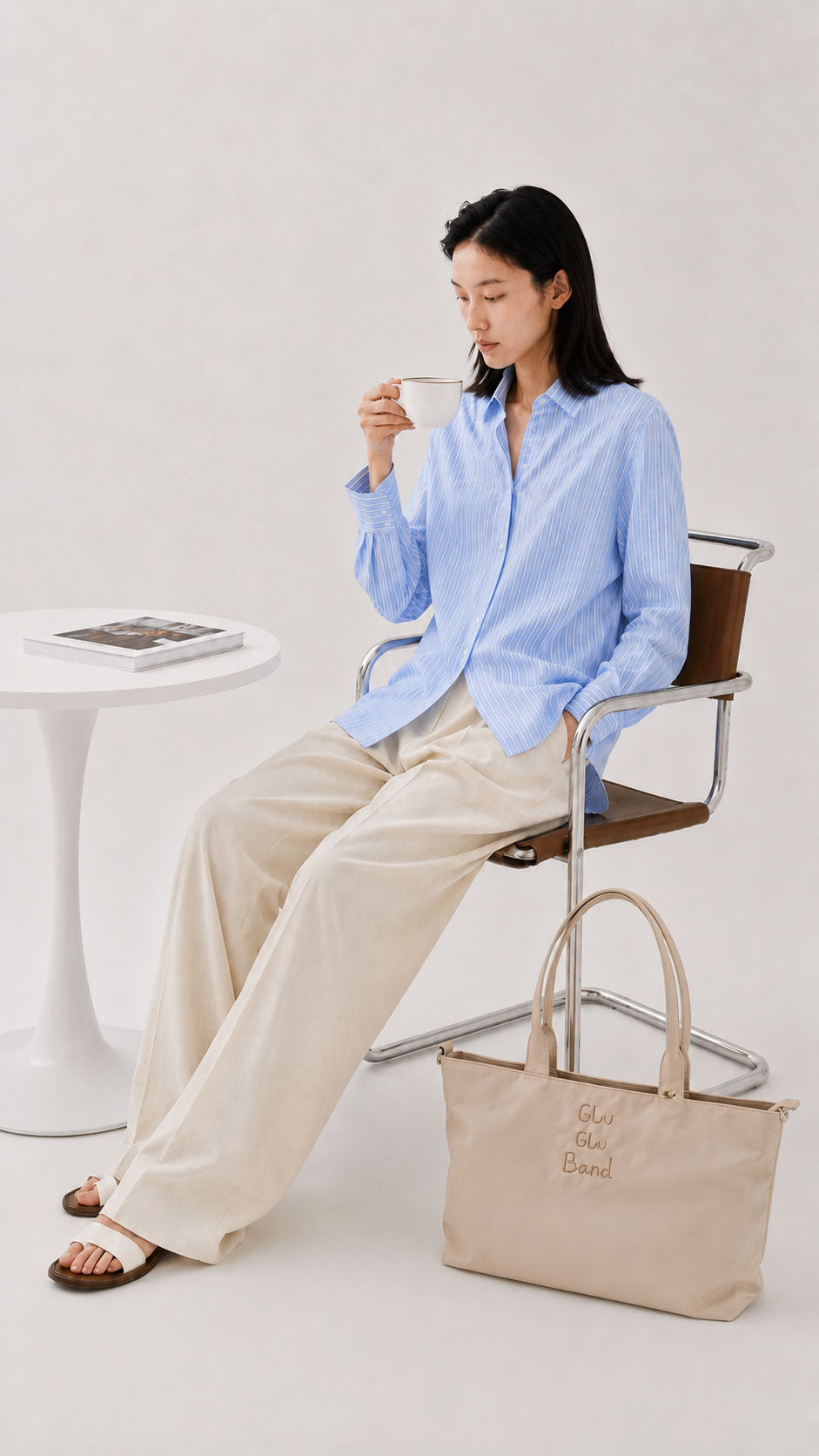 Champagne 14-inch laptop work tote beside a seated woman