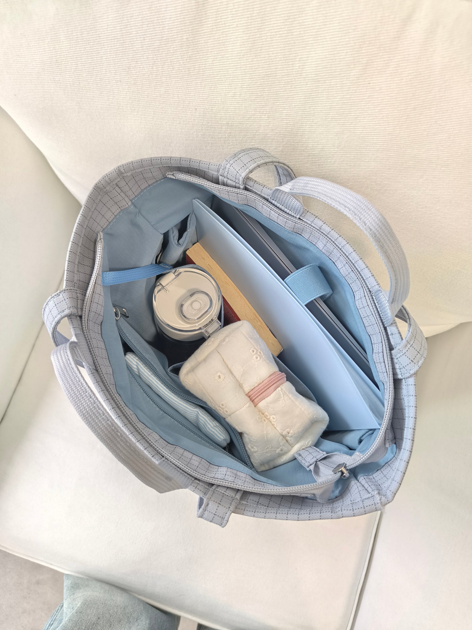 Open vertical laptop bag with organized interior compartments