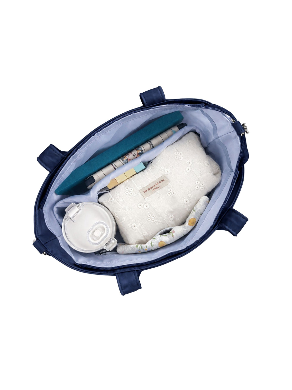 Open night blue 12-inch water-resistant iPad tote bag packed with laptop and daily essentials