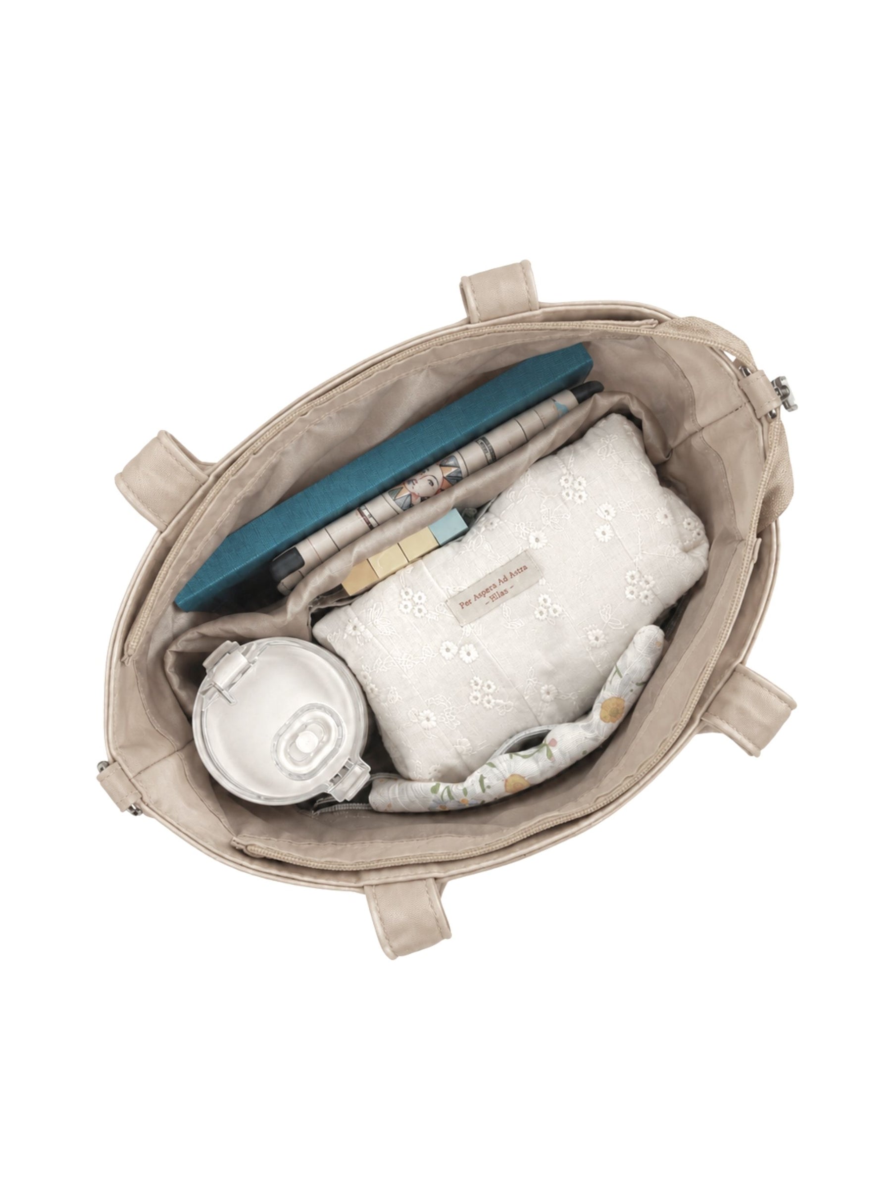 Open champagne 12-inch water-resistant iPad tote bag packed with laptop and daily essentials