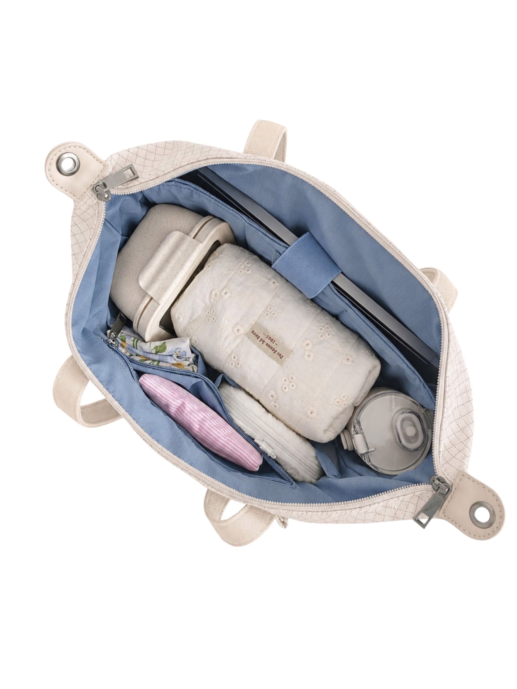 Open beige 14-inch water-resistant laptop tote bag packed with laptop and daily essentials