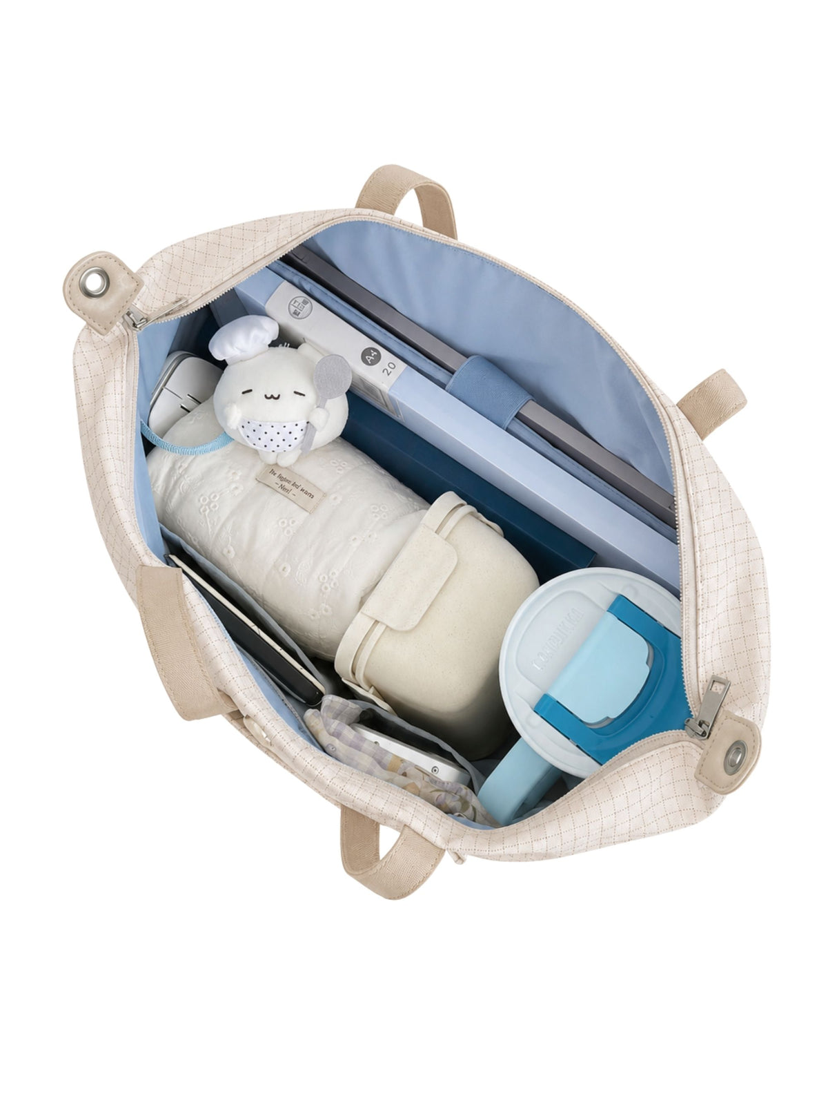 Open beige 16-inch water-resistant laptop tote bag packed with laptop and daily essentials