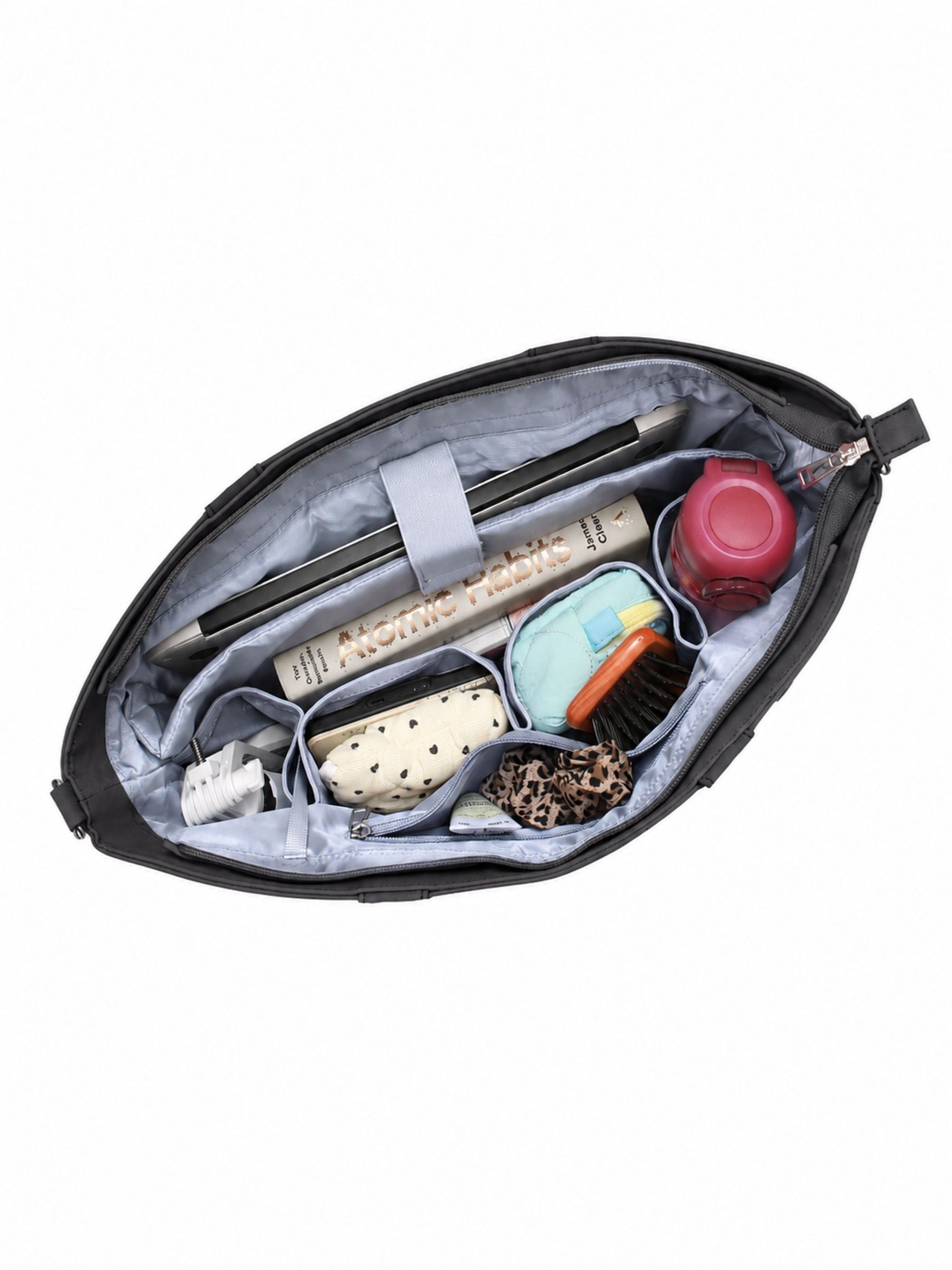 Open carbon black 16-inch water-resistant laptop tote bag packed with laptop and daily essentials