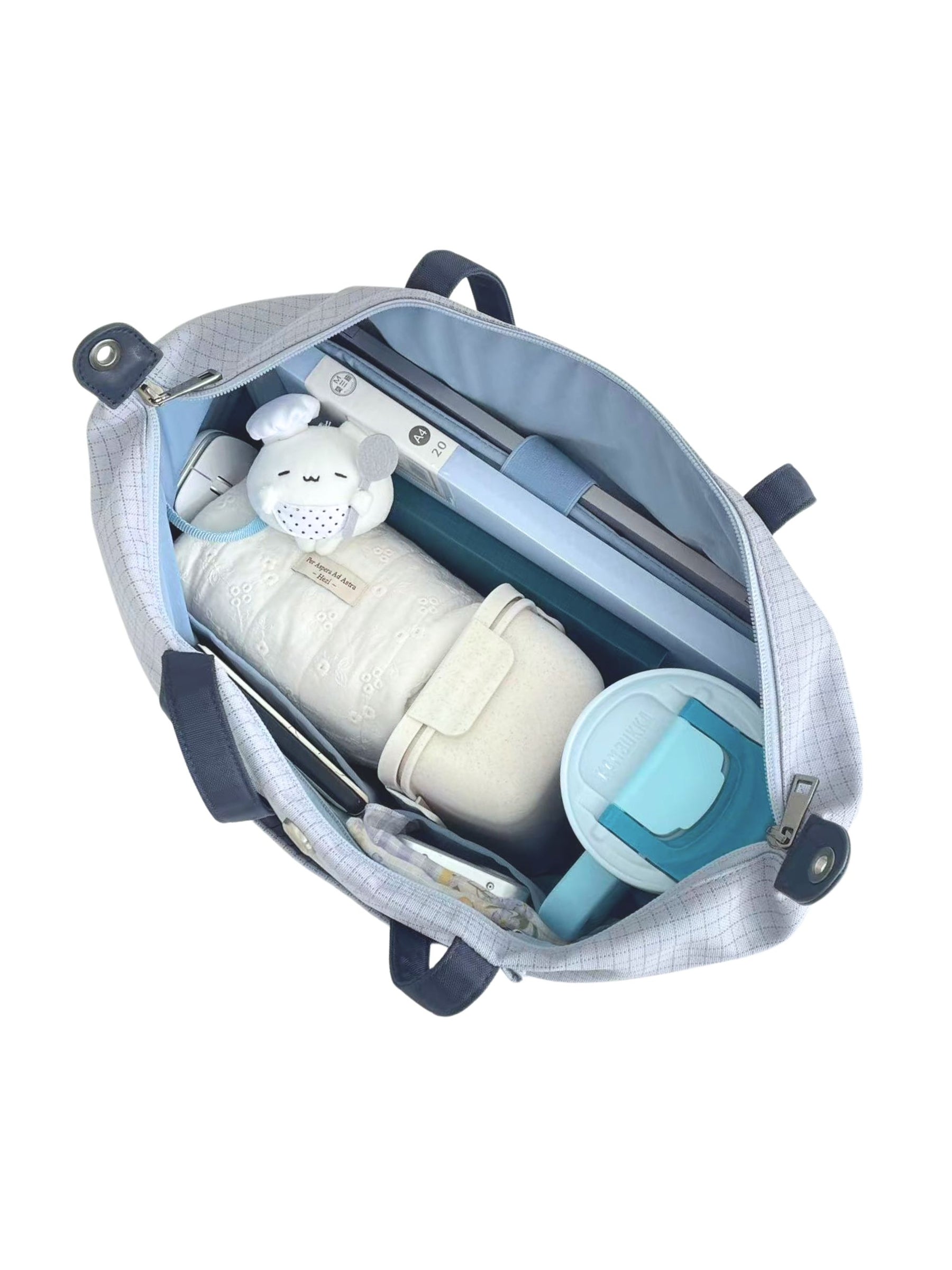 Open light blue 16-inch water-resistant laptop tote bag packed with laptop and daily essentials