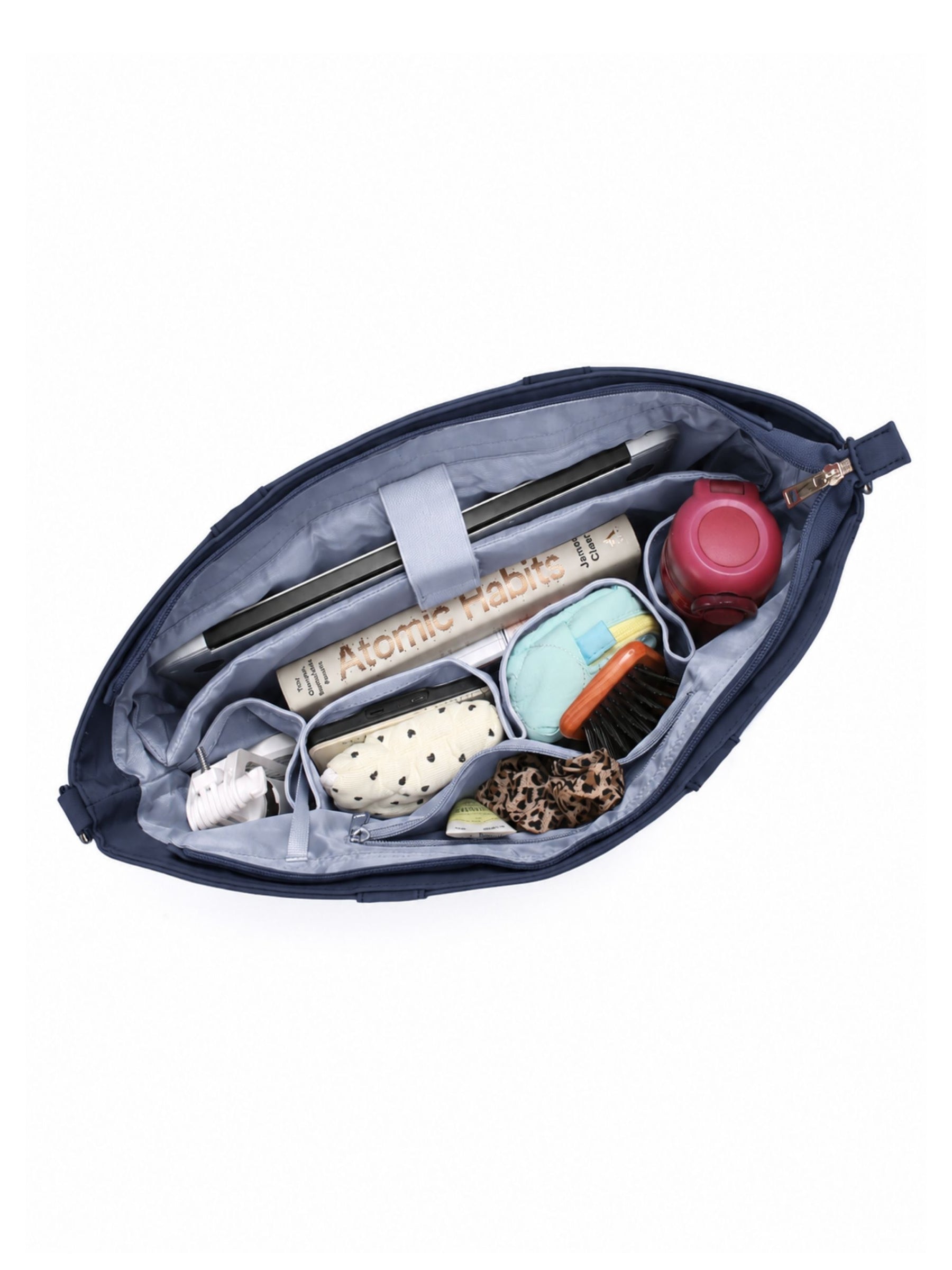 Open night blue 16-inch water-resistant laptop tote bag packed with laptop and daily essentials