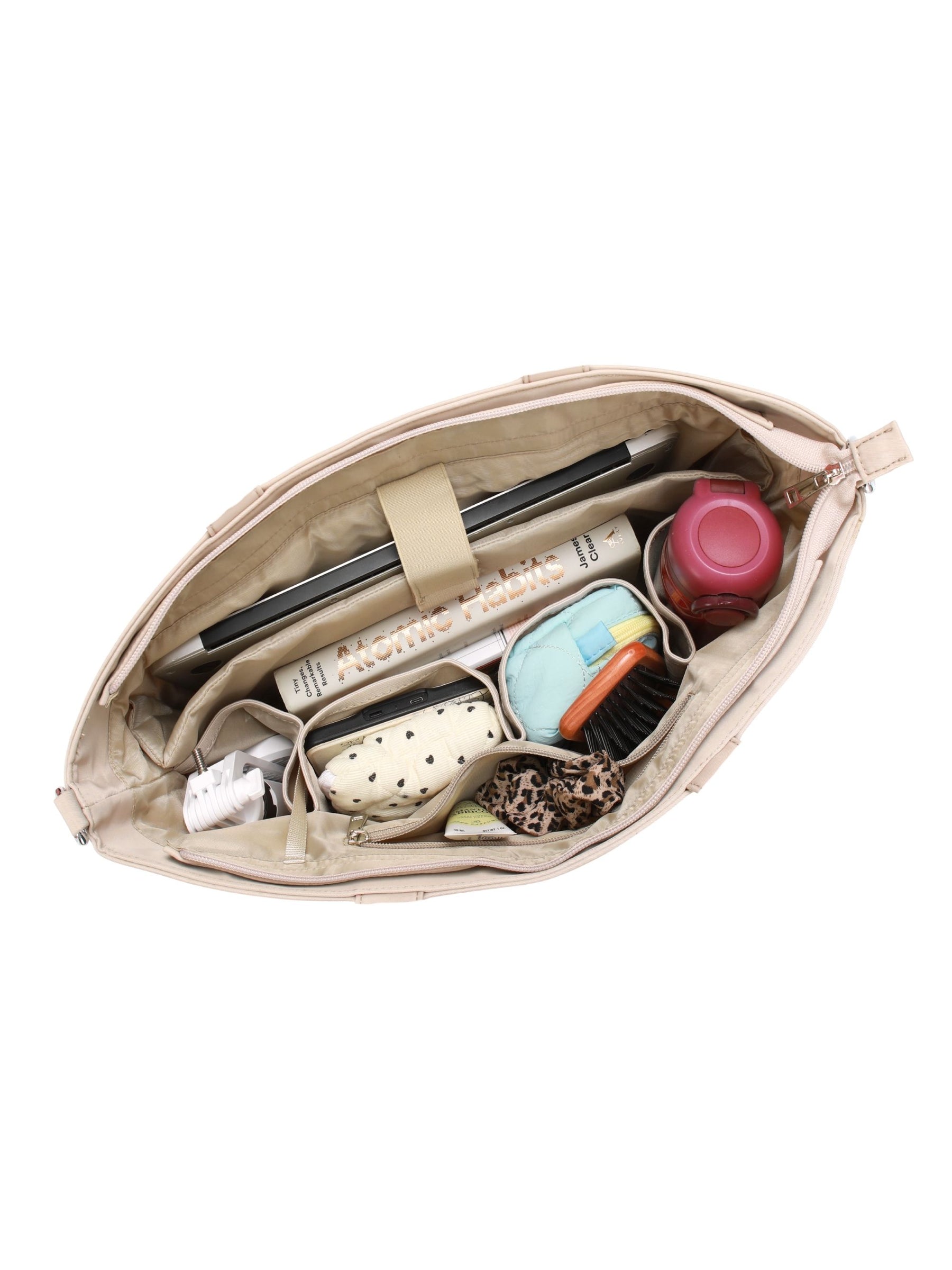 Open champagne 16-inch water-resistant laptop tote bag packed with laptop and daily essentials