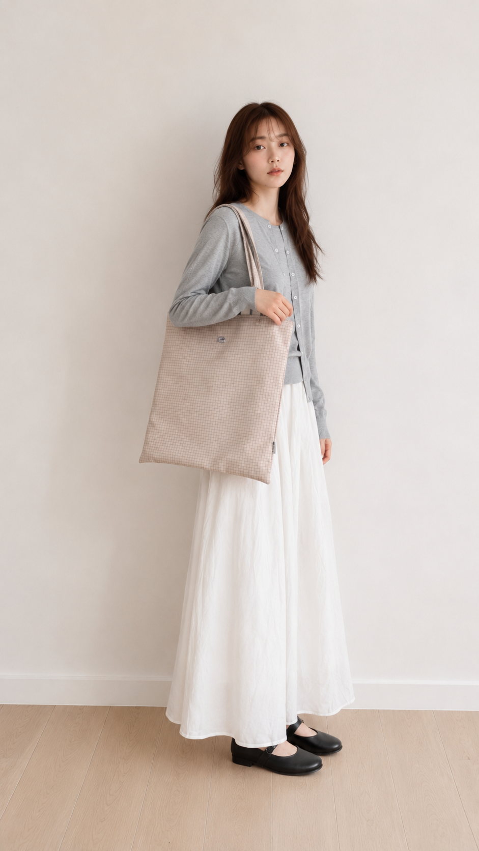 Woman carrying a beige 15.6-inch laptop shoulder bag