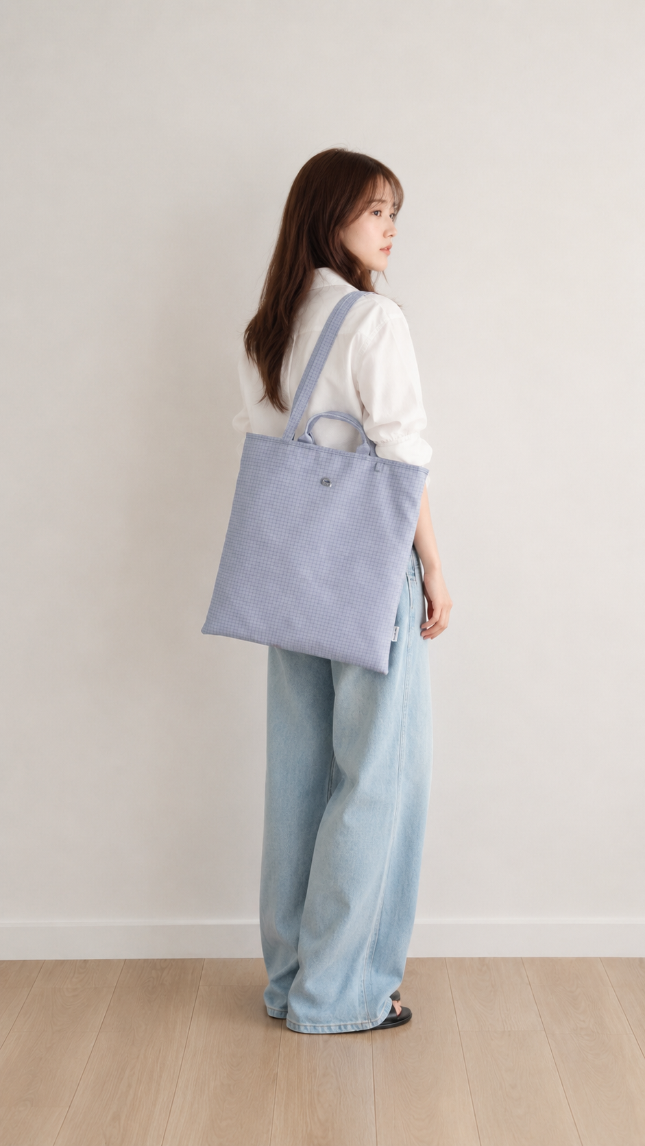 Side view of a light purple vertical laptop tote bag
