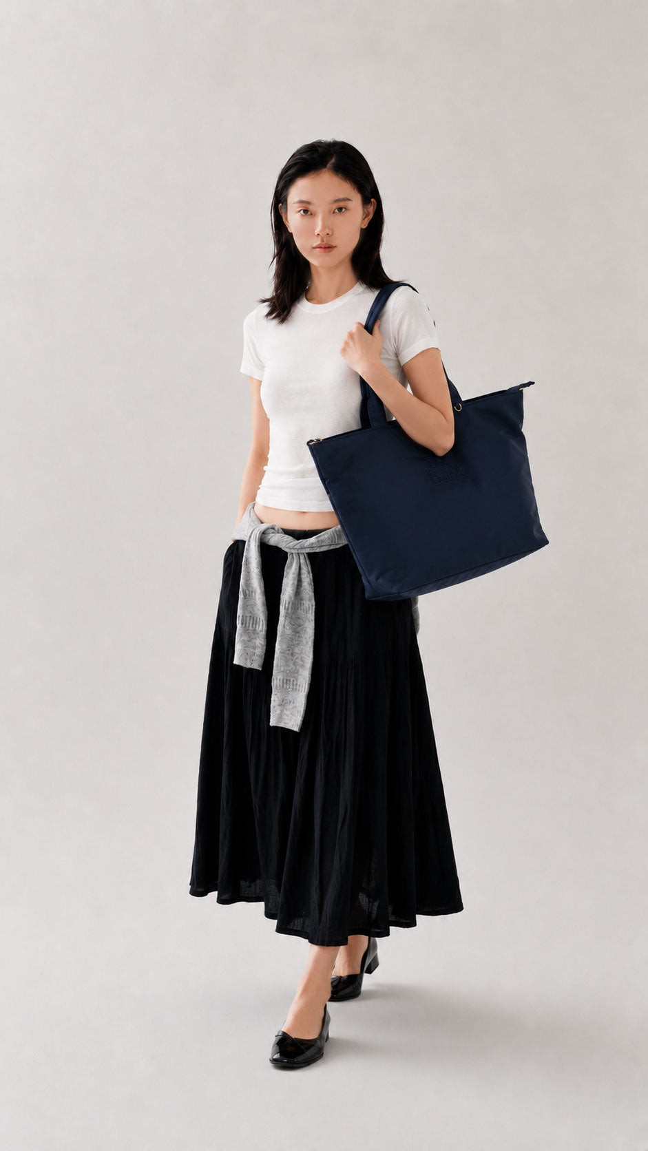 Woman carrying a night blue 14-inch laptop work bag