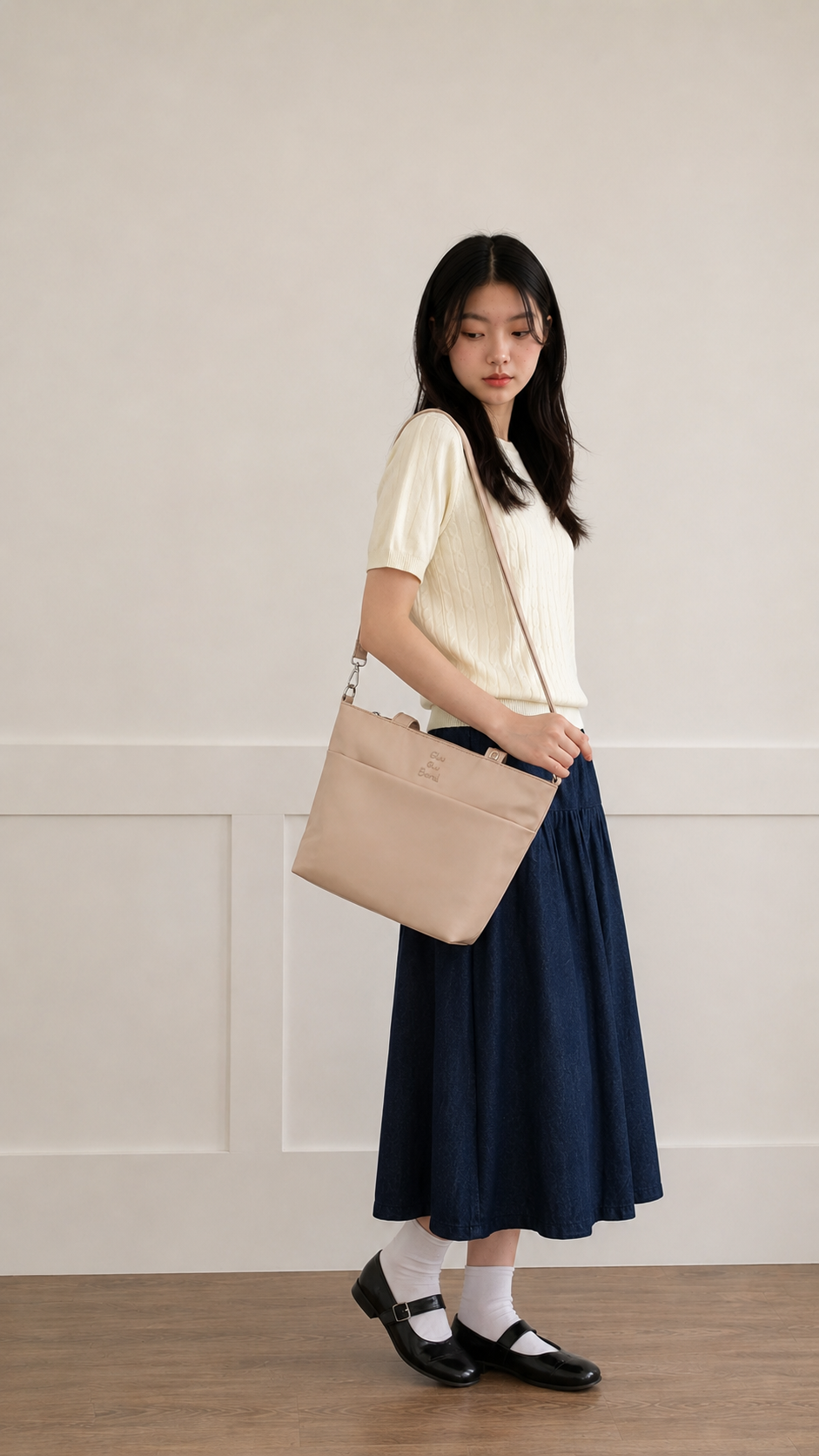 Woman carrying a champagne water-resistant iPad tote bag
