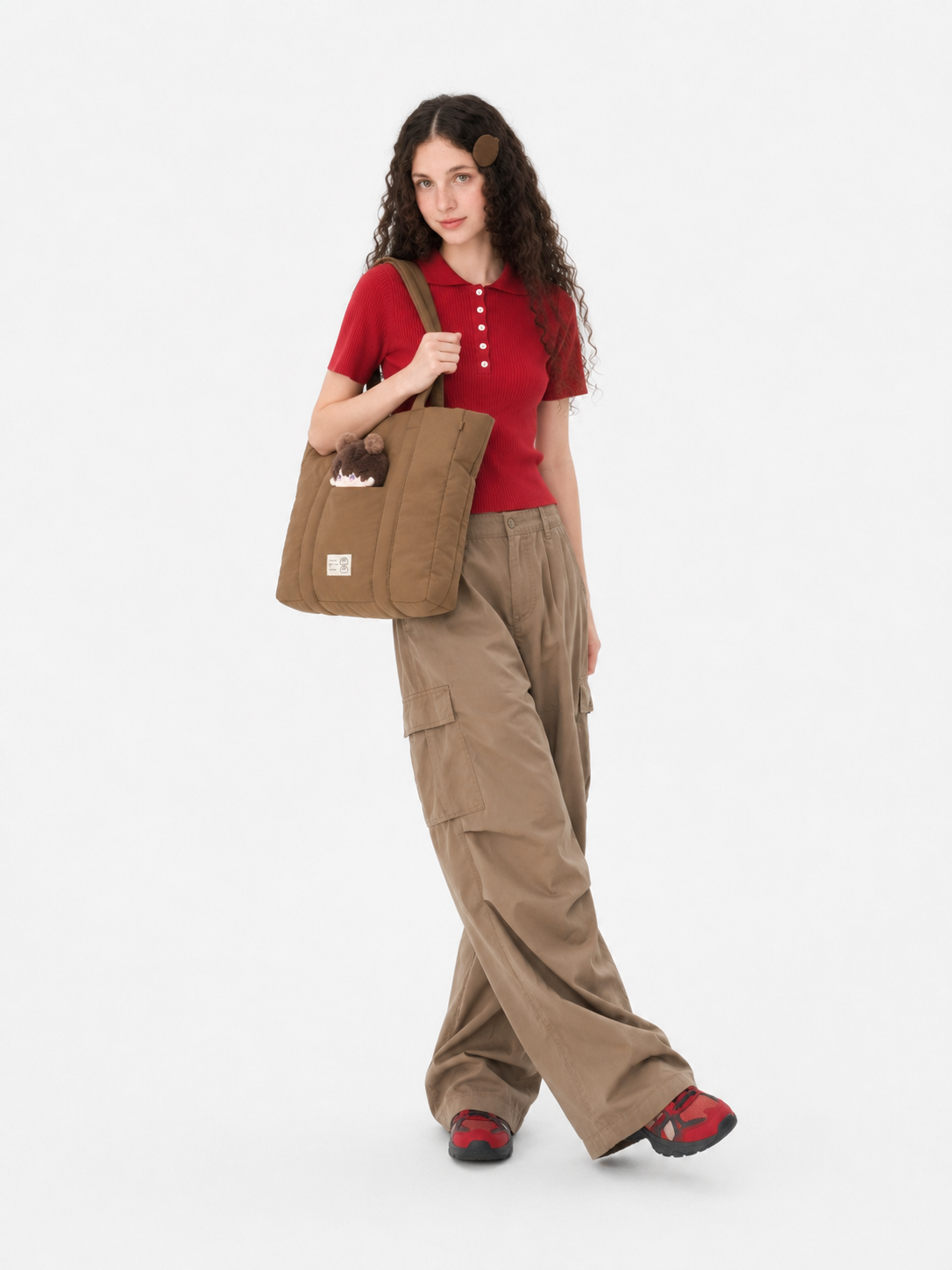 Woman wearing a brown 16-inch laptop work tote