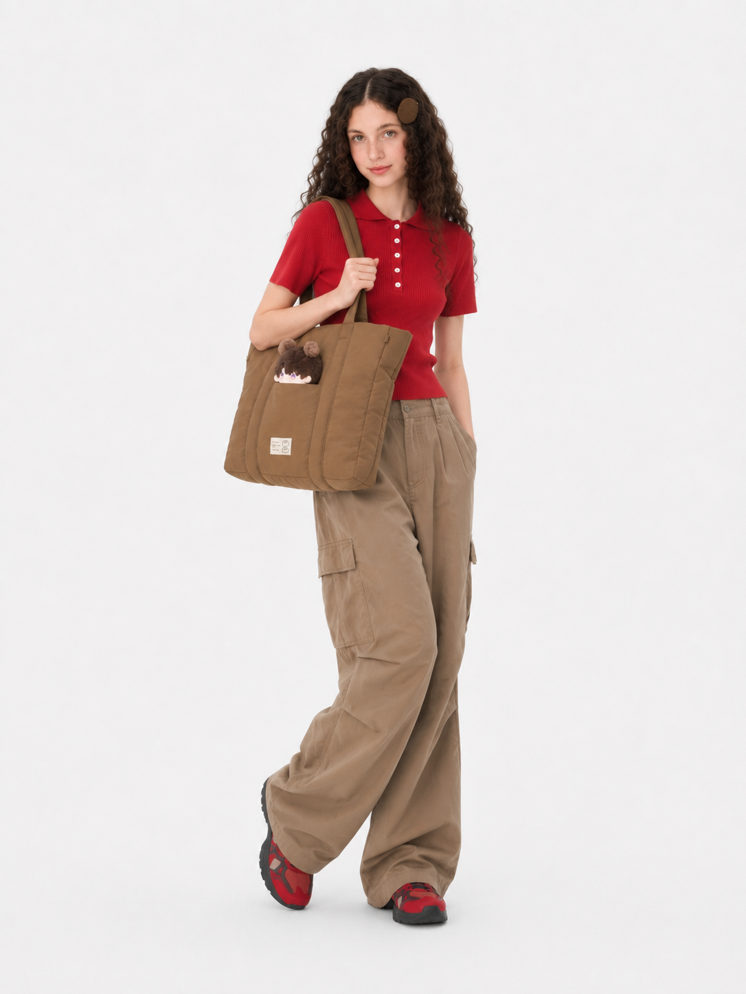 Woman wearing a brown puffer laptop tote over her shoulder