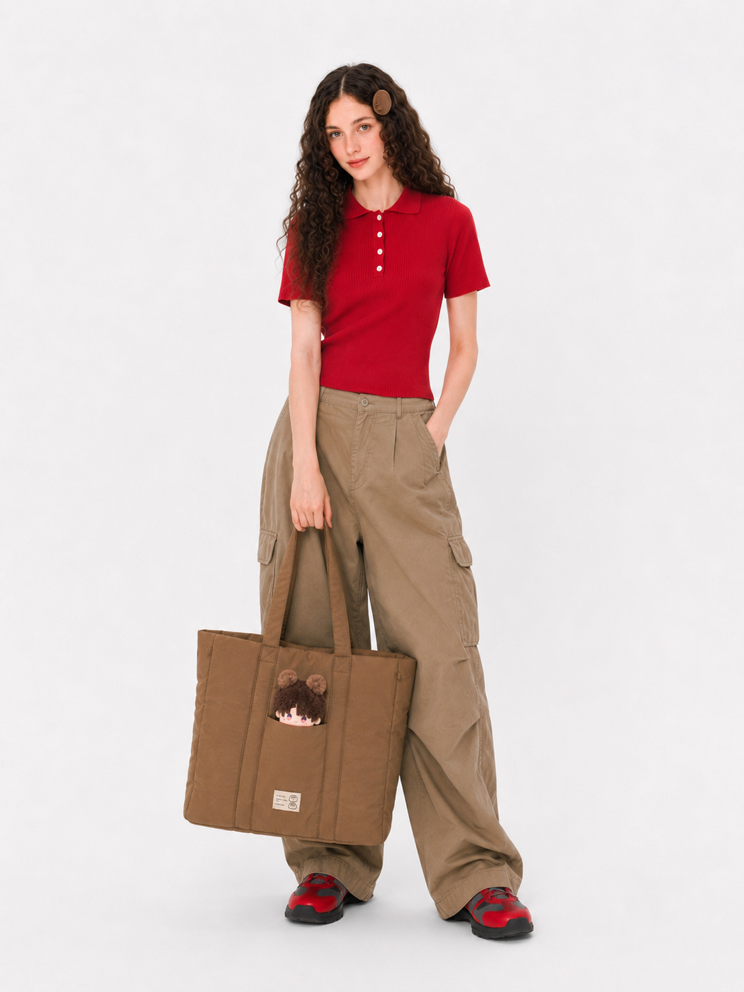Woman holding a brown padded laptop tote bag