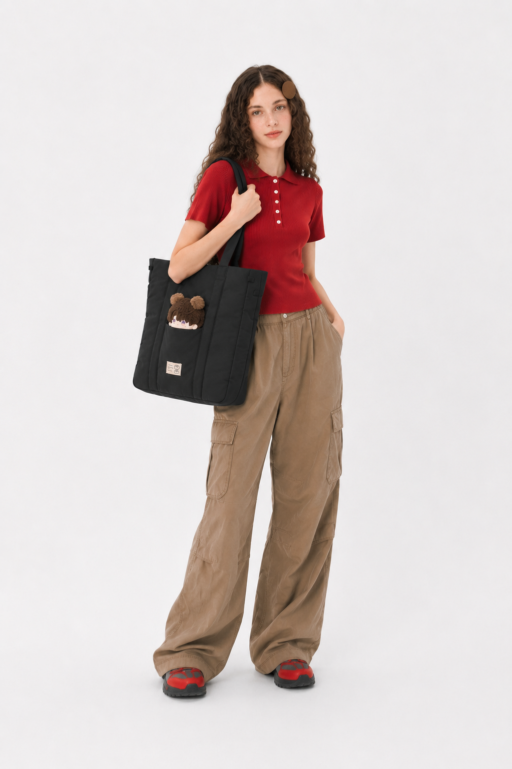 Woman wearing a black padded laptop tote over her shoulder