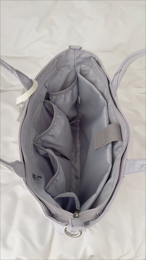 Open 16-inch laptop tote showing interior pockets and compartments
